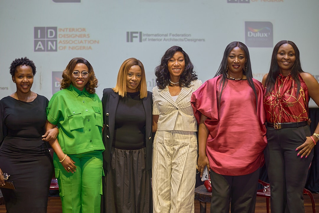 Six women standing together at an IDAN event